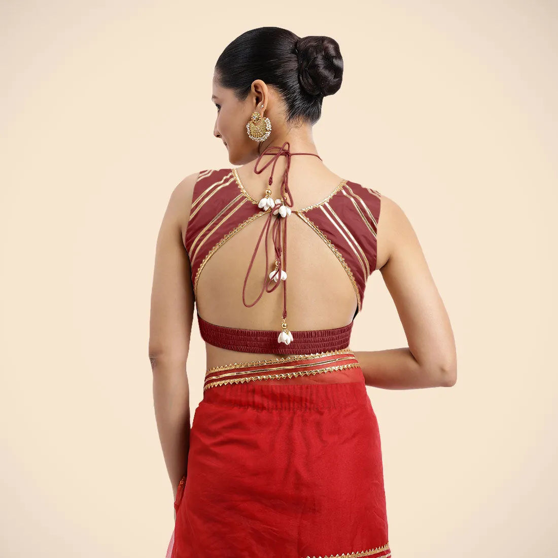 Ahana x Tyohaar | Auburn Red Sleeveless FlexiFit™ Saree Blouse with Plunging Neckline and Back Cut Out with Tasteful Golden Gota Lace Embellishment